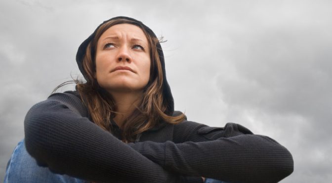 girl sitting and thinking